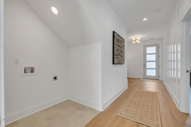 interior space featuring hardwood / wood-style flooring, electric dryer hookup, and hookup for a washing machine