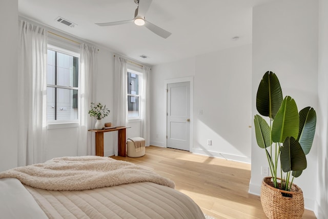 bedroom featuring light wood-type flooring and ceiling fan