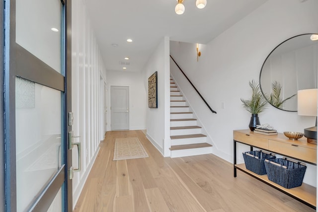 corridor with light hardwood / wood-style flooring