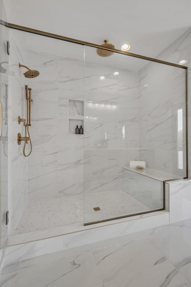 bathroom with a shower with shower door