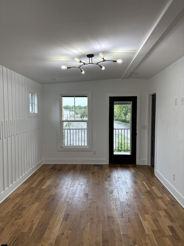 unfurnished room featuring dark hardwood / wood-style flooring