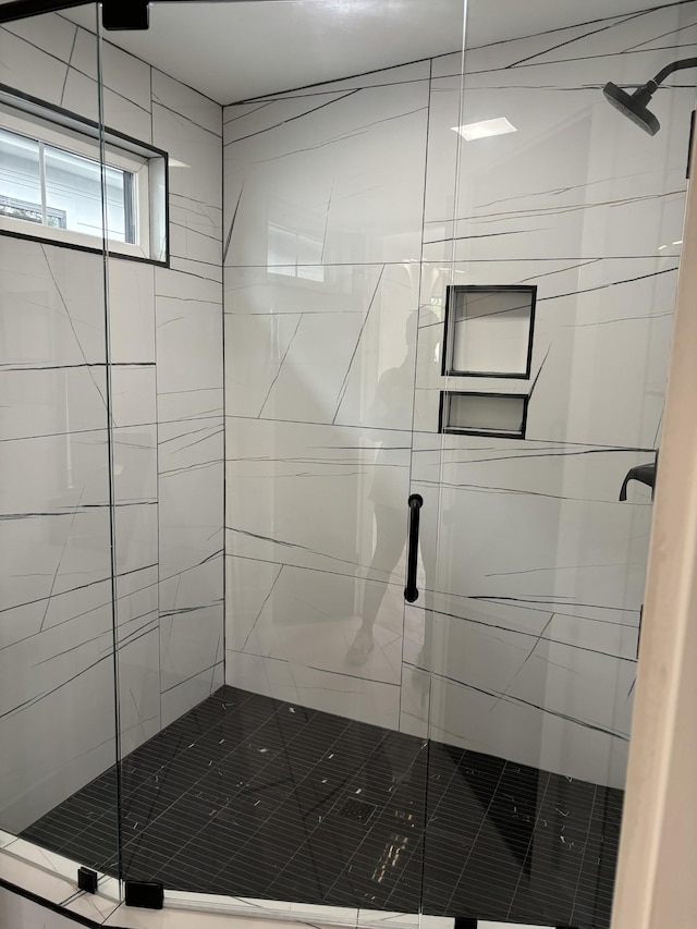 bathroom featuring an enclosed shower