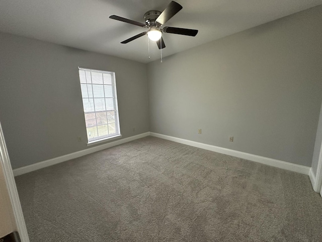 empty room with carpet and ceiling fan