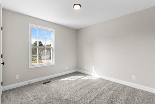 unfurnished room featuring carpet