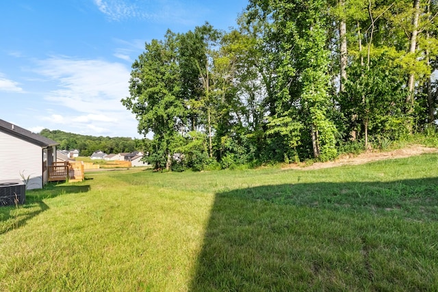 view of yard with central AC