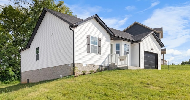 exterior space with a front yard and a garage