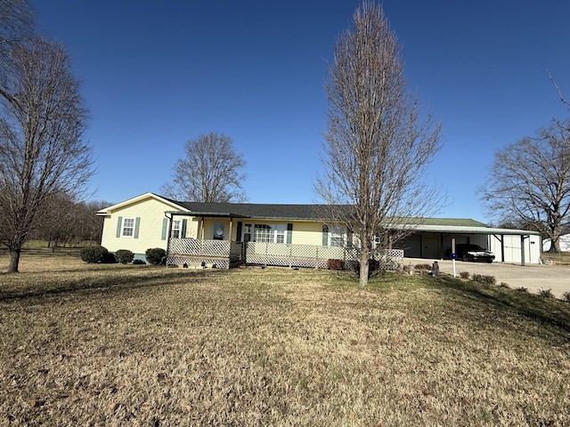 ranch-style home with a front yard and a carport