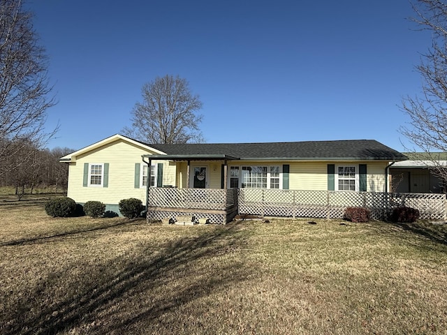 single story home with a front lawn