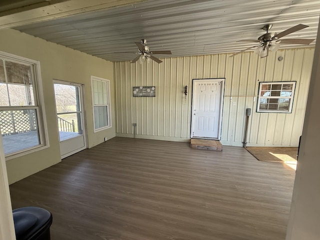 interior space with ceiling fan and wooden ceiling