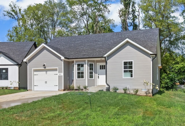 view of front of home featuring a front yard and a garage