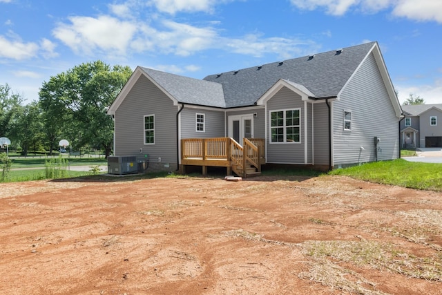 rear view of house with french doors and cooling unit