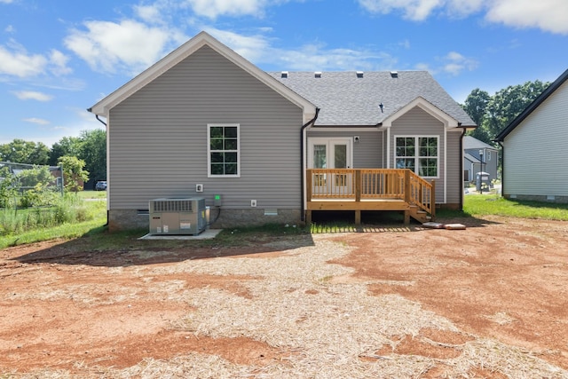 rear view of property with central AC, french doors, and a deck