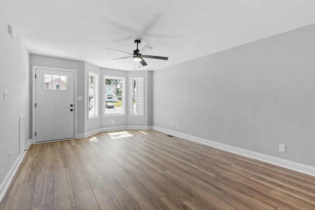 entryway with ceiling fan and light wood-type flooring