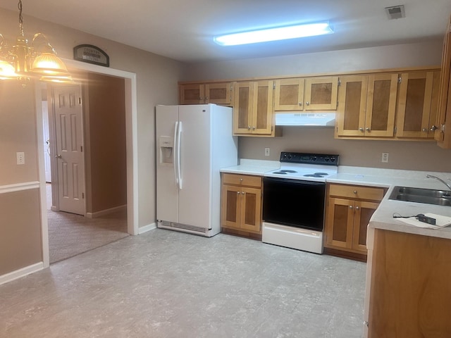 kitchen with white appliances, decorative light fixtures, a notable chandelier, and sink