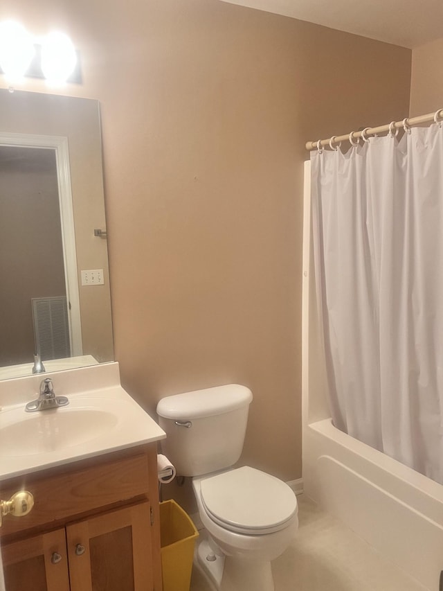 full bathroom featuring tile patterned flooring, shower / bath combo, vanity, and toilet