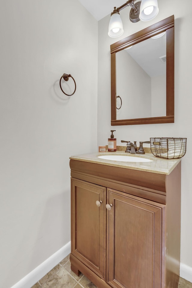 bathroom featuring tile patterned flooring and vanity