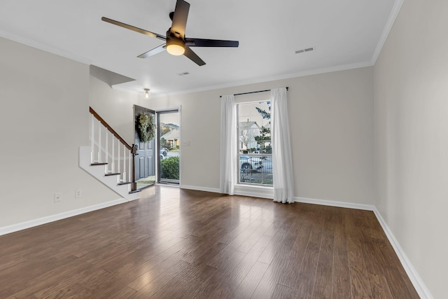 spare room with dark hardwood / wood-style floors, ceiling fan, and crown molding