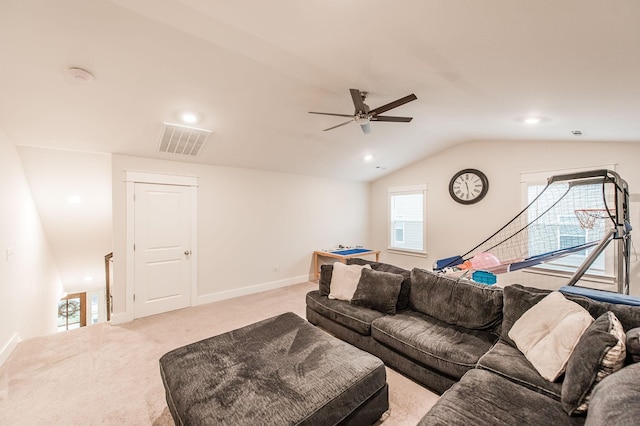 carpeted living room with ceiling fan and lofted ceiling