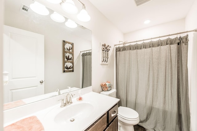 bathroom with a shower with curtain, vanity, and toilet