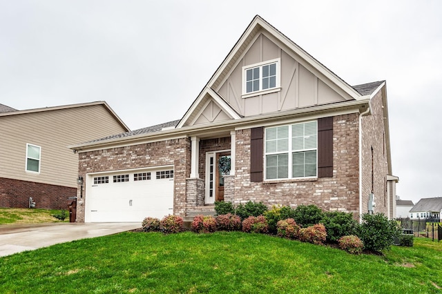 view of front of house with a front yard and a garage