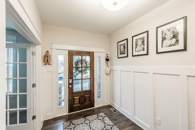 entryway with dark hardwood / wood-style floors