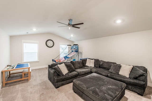 living room featuring light carpet, vaulted ceiling, and ceiling fan