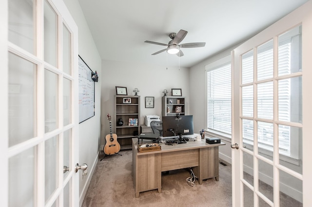 carpeted office featuring ceiling fan and french doors