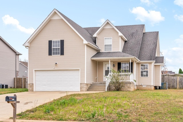 view of front facade with a porch, cooling unit, a garage, and a front yard