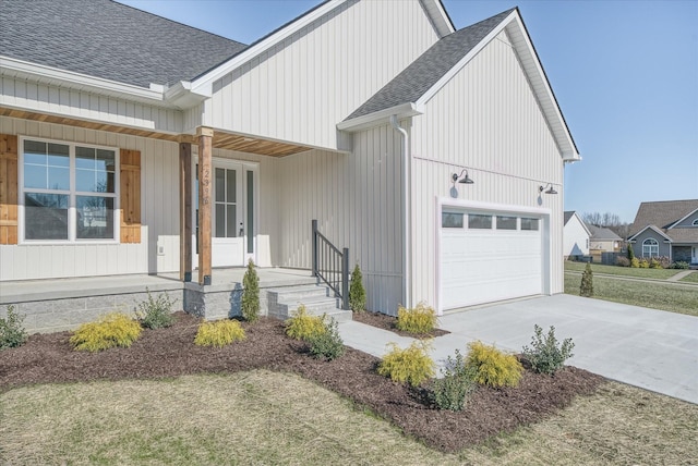 view of front of home with a garage and a porch