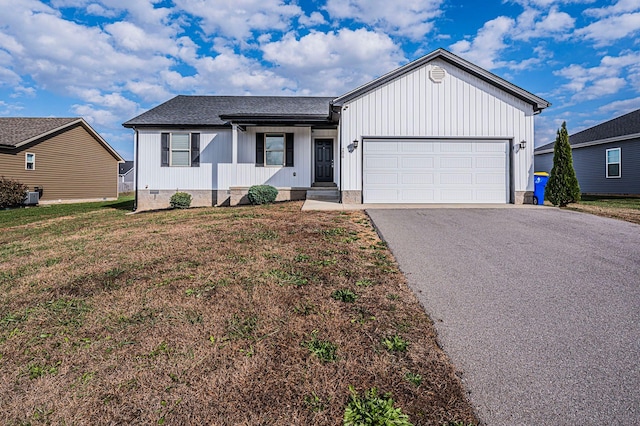 view of front facade featuring a garage and a front lawn