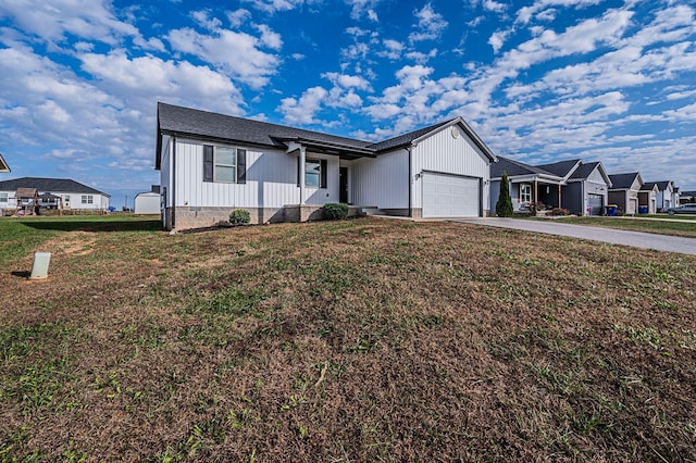 single story home with a garage and a front lawn