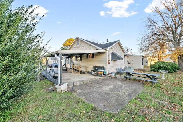 rear view of house with central AC