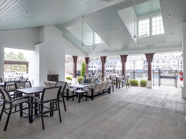 view of patio with an outdoor living space with a fireplace