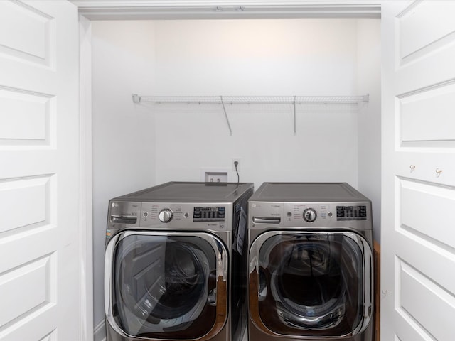 laundry area with washer and clothes dryer