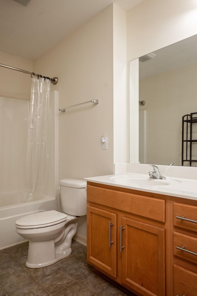 full bathroom featuring tile patterned floors, shower / bath combo with shower curtain, vanity, and toilet