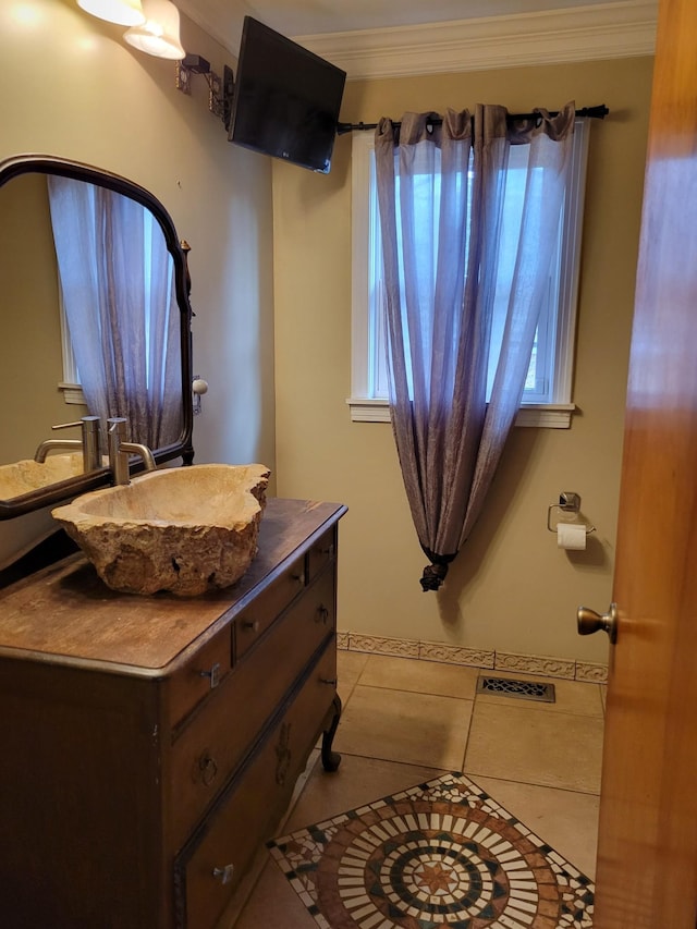 bathroom with tile patterned flooring, vanity, and ornamental molding