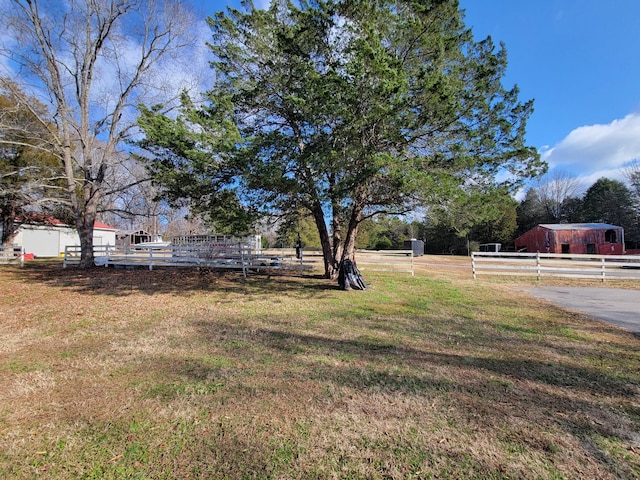 view of yard with a rural view