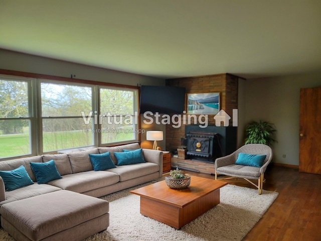 2228 Granny Wright Ln, Hermitage, TN 37076 - living area with a wood stove, wood finished floors, and baseboards