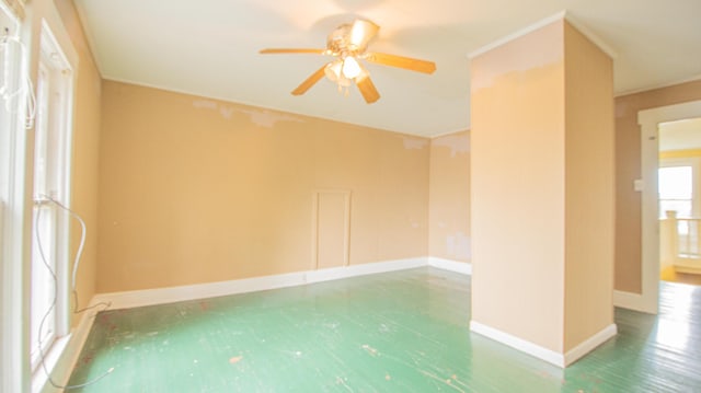 spare room with hardwood / wood-style flooring and ceiling fan