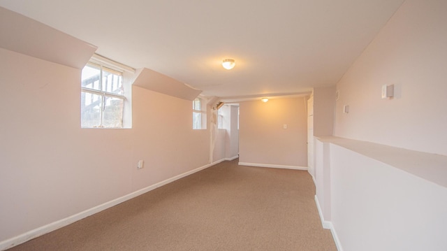 basement with light colored carpet