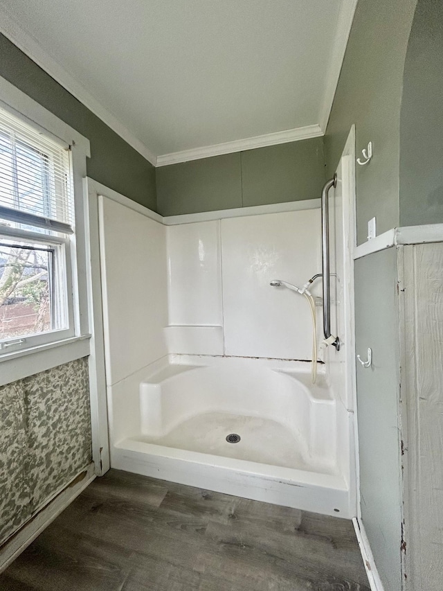 bathroom featuring walk in shower, wood-type flooring, and ornamental molding