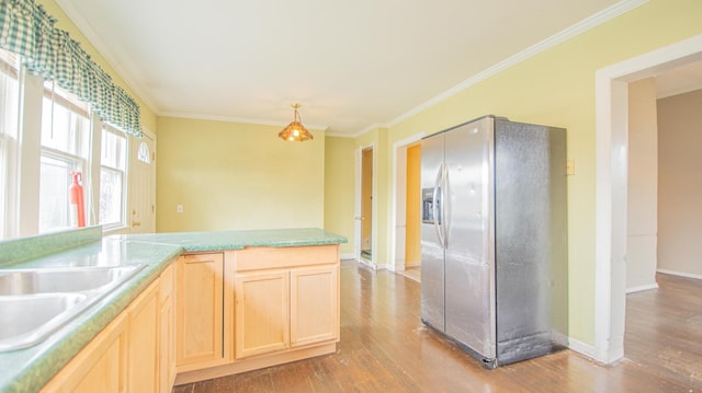 kitchen featuring crown molding, light brown cabinets, stainless steel refrigerator with ice dispenser, and light hardwood / wood-style flooring