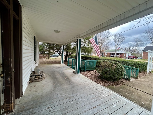 wooden deck featuring covered porch