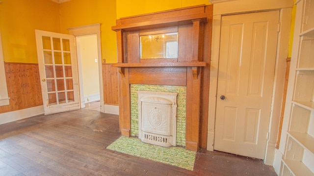 details with wood-type flooring and wooden walls