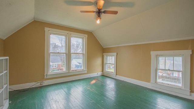 bonus room with ceiling fan, dark hardwood / wood-style flooring, and vaulted ceiling