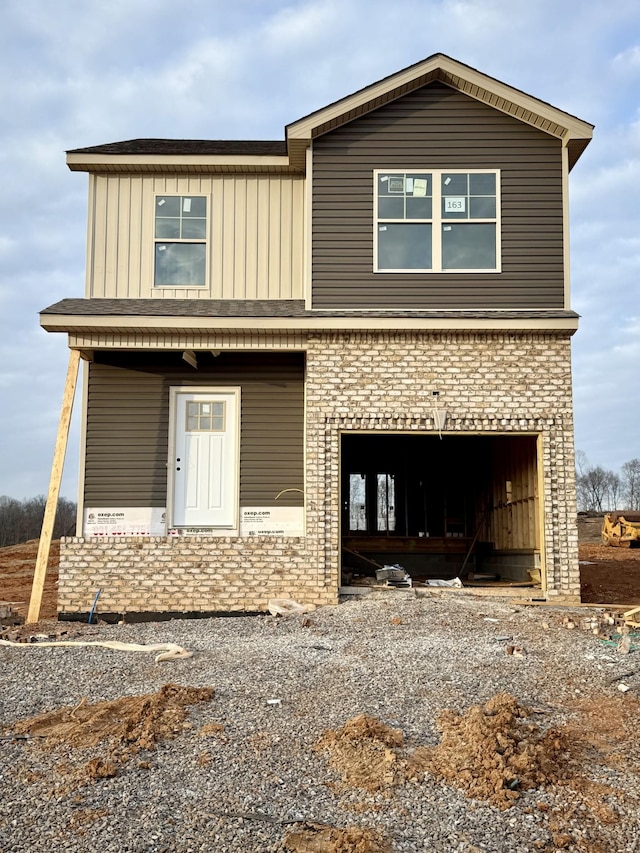 front facade with a garage