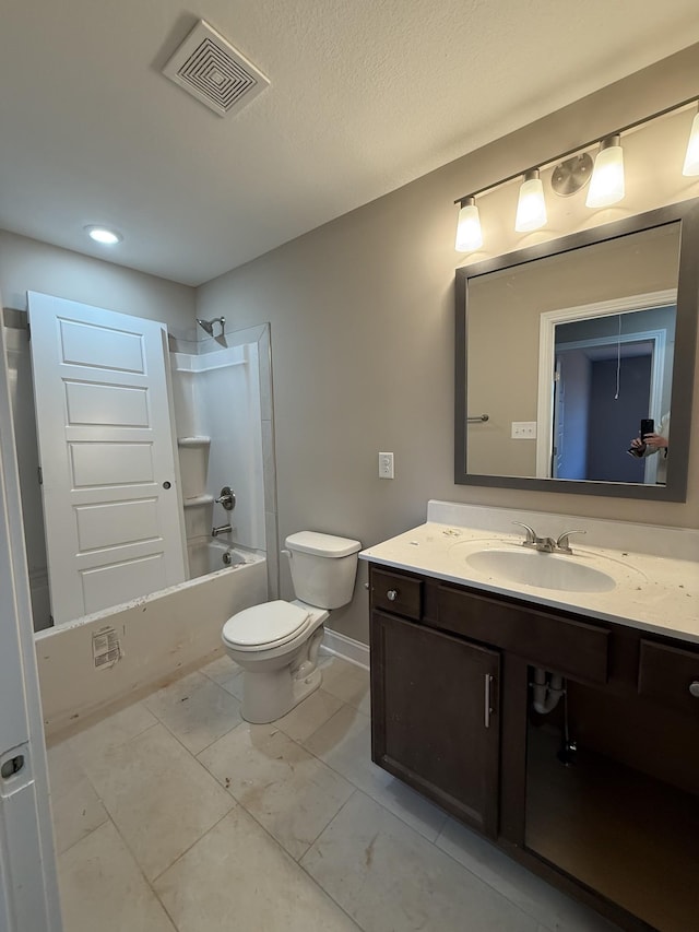 full bathroom featuring toilet, vanity, visible vents, baseboards, and shower / bathing tub combination