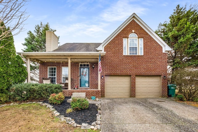 view of front of house featuring covered porch and a garage