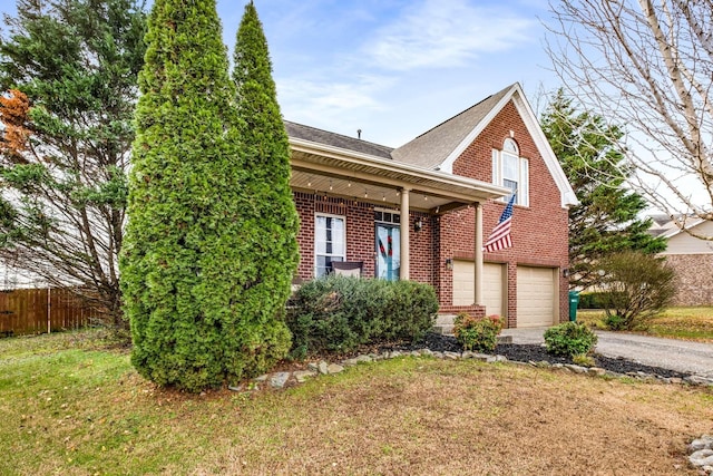 view of front facade with a garage and a front lawn