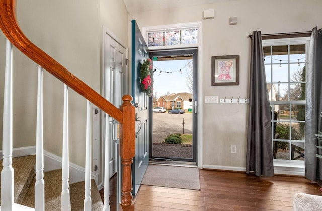 entryway with dark wood-type flooring